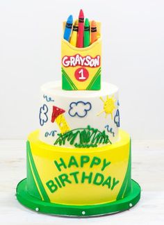 a birthday cake with crayons on it