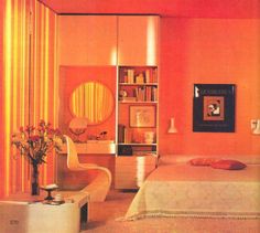 an orange bedroom with white furniture and flowers in vases on the bed, bookshelf