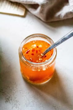 a jar filled with liquid sitting on top of a table