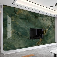 a living room with green marble walls and a flat screen tv mounted on the wall