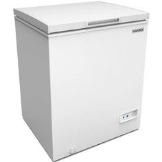 a white chest freezer sitting on top of a white floor next to a wall