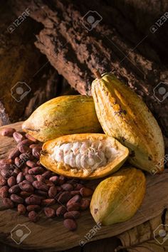 an assortment of tropical fruits and nuts on a wooden table stock photo - 957982