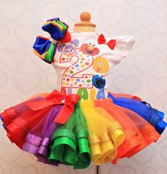 there is a dress made out of colorful tutues on a mannequin