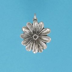 DESCRIPTION There is nothing like a field full of blooming Daisies. With their faces turned up to the sunshine, these bright flowers represent childhood, innocence and purity. Our shiny sterling silver Daisy charm makes a great gift for some one you love. Original design by Pat Frey 3/4 inch around Type: Three Dimensional Item Number: 1191 Flowers Represent, Childhood Innocence, Daisy Charm, Bright Flowers, Flower Charm, The Sunshine, Daisy Flower, Pendant Earrings, Gold Vermeil