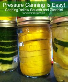 three jars filled with pickles and cucumbers