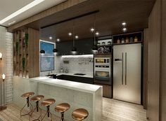 a modern kitchen with stools next to the counter and refrigerator freezer on the wall