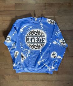 Bleached Blue Cowboys Cheetah Print Crewneck Sweatshirt! Each item is handmade and no two items are exactly the same. They will slightly vary because of my tye dye and bleaching techniques! Please message for any questions! Bleached and Sublimation! Disclaimer: Not Responsible for lost/damaged/stolen/delayed packages. You will be responsible to file a claim through the shipping carrier! Thanks! Bleached Sweatshirt, Personalised Fans, Cowboys Logo, Fan Gear, Cheetah Print, Game Day