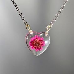 Luxury Handmade Resin Jewelry, Handmade Flower Necklace For Valentine's Day, Silver Flower Necklace For Valentine's Day, Handmade Clear Flower Necklace, Clear Flower Pendant Necklace As Gift, Clear Flower Pendant Necklace For Gift, Valentine's Day Flower Necklace With Pressed Flowers, Clear Flower-shaped Necklace For Gift, Clear Flower Shaped Jewelry Gift