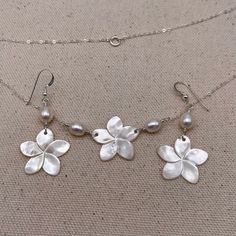 Mother of Pearl Plumeria Necklace, Coin Pearl Frangiani Necklace - Etsy White Mother Of Pearl Flower Shaped Jewelry, White Mother Of Pearl Jewelry In Flower Shape, White Mother Of Pearl Jewelry With Flower Charm, Pearl Jewelry With Mother Of Pearl Buttons For Gift, White Flower-shaped Mother Of Pearl Jewelry, White Mother Of Pearl Flower Jewelry, Silver Flower-shaped Jewelry With Pearl Charm, Silver Floral Jewelry With Pearl Charm, Silver Flower Jewelry With Pearl Charm