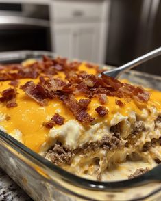 a casserole dish with meat, cheese and bacon in it is ready to be eaten