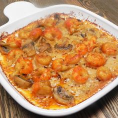 a large pot filled with food on top of a counter next to a silver spoon