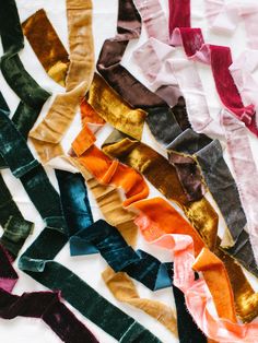 many different colored ties laid out on top of each other