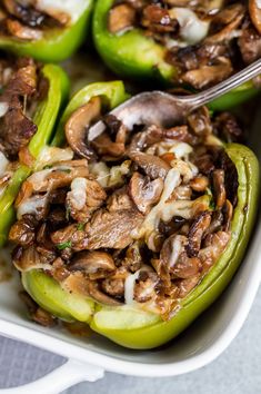 stuffed bell peppers with mushrooms and onions in a casserole dish, ready to be eaten