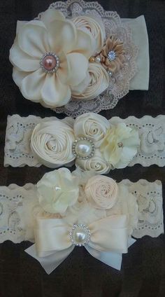 three garters with flowers and pearls on them