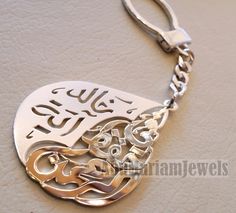 Key chain name arabic and phrase made to order customized sterling silver 925 big size في حفظ الرحمن - 2 اسماء عربي The names on the sample Khaled and Aya The phrase In god protection . خالد و آية في حفظ الرحمن please allow 10 to 15 days to complete , this is made to order item . write your name or the name you want in English or Arabic , with the order please . A sketch drawing of the names will be sent to you after 2 -3 days of payment for confirmation before we work on silver - see pictures- Spiritual Silver Jewelry With Custom Name, Custom Name Silver Spiritual Jewelry, Custom Name Spiritual Silver Jewelry, Spiritual Custom Name Silver Jewelry, Traditional Silver Customized Jewelry, Customized Traditional Silver Jewelry, Traditional Customized Silver Jewelry, God Protection, Names Arabic