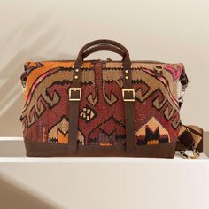 Handwoven kilim with genine Leather Traditional Brown Rectangular Weekender Bag, Traditional Brown Weekender Bag With Leather Handles, Bohemian Brown Duffle Bag With Leather Handles, Brown Bohemian Duffle Bag With Leather Handles, Bohemian Brown Rectangular Travel Bag, Bohemian Brown Satchel Travel Bag, Handmade Tapestry Shoulder Bag For Travel, Brown Tapestry Travel Bag, Brown Tapestry Travel Satchel