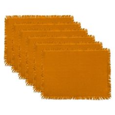 five orange napkins with fringe on them