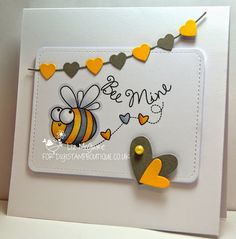 a close up of a greeting card with a bee on the front and hearts on the back