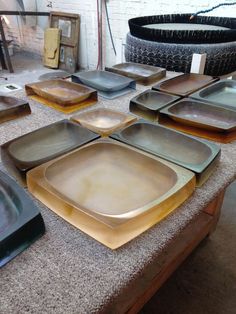 there are many plates that are on the table and ready to be put in the oven