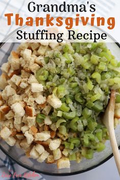 a glass bowl filled with stuffing next to a wooden spoon on top of a table