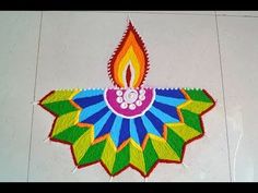 a colorful diwali with a lit candle on it