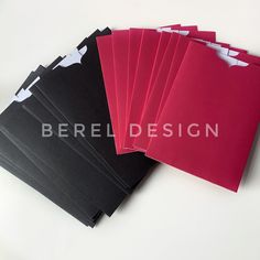 six red and black folders on a white surface with the words bereddesign