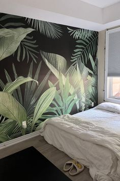 Jungle leaf wallpaper, with green leaves on a black background, on an accent wall in a bedroom. Black Palm Leaf Wallpaper, Tropical Leaves Wall Art, Jungle Leaf Painting, Two Tone Green Wall, Green Wallpaper Accent Wall, Leaf Accent Wall, Jungle Leaf Wallpaper, Dramatic Accent Wall, Dinosaur Bathroom