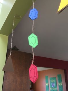 some paper hexagonals are hanging from the ceiling