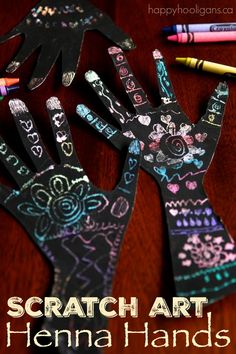 the hands are made out of black paper and colored crayons