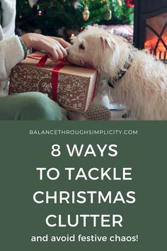 a white dog with its head in a present box and the words 8 ways to tackle christmas clutter and avoid festive chaos