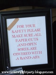 a framed sign that says for your safety please make sure all paper cuts and open sores are covered with a band aid