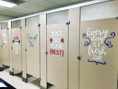 a row of restroom stalls with writing on the walls and doors that say, every day is a fresh start