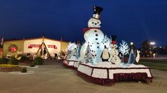 there is a snowman and other decorations on display