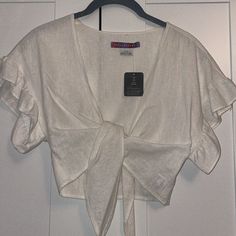 Urban Outfitters Cropped Wrapped Linen Top Never Worn- New With Tags In Excellent Condition Ruffled Short Sleeve Urban Outfitters Blouse For Vacation, Urban Outfitters Summer Beach Blouse, Summer V-neck Blouse By Urban Outfitters, Urban Outfitters White Summer Crop Top, Urban Outfitters Summer V-neck Blouse, Fitted Urban Outfitters Top With Button Closure, Urban Outfitters V-neck Crop Top, Linen Wrap Top, Urban Outfitters Tops