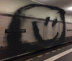 graffiti on the wall of a subway station