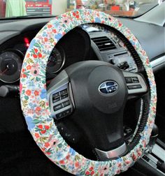 the steering wheel cover is decorated with flowers