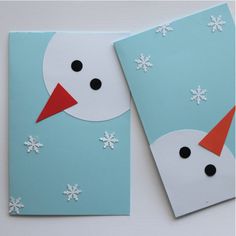 two snowmen made out of construction paper