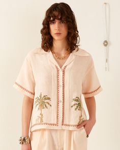 A person with wavy brown hair is wearing a Stevie Sanded Palm Shirt Slightly Cropped Shirt, Bohemian Top, Designer Punjabi Suits, White Stripes Shirt, Purple Paisley, Vintage Hawaiian Shirts, Bohemian Tops, Open Neck, Summer Favorites