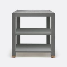 a grey shelf with two shelves on each side and one shelf in the middle, against a white background