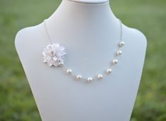 "The Listing is for 1 Dahlia Necklace. There are 2 colors to choose from : White Dahlia ( go with White Glass Pearls) or Ivory Dahlia ( go with Ivory/ Cream Glass Pearls) NOTE : if you prefer different color other than white or Ivory color, please drop a note or convo me when you check out. Variety Dahlia Flower Necklace and Jewelry available in my shop, if you do not find in the listings, feel free to contact me. * Hand Sculpted Dahlia. Size; approx ; 1.5\" * 8mm Ivory/cream/Offwhite Glass pear White Flower Jewelry For Bridesmaid Gift, White Floral Jewelry For Bridesmaid Gift, Elegant White Flower Bridal Necklace, White Pearl Jewelry With Flower Decoration, Pearl White Flower Necklaces For Wedding, White Flower Pendant Necklace For Wedding, White Pearl Flower Necklace For Weddings, White Necklaces With Handmade Flowers For Gift, White Necklaces With Handmade Flowers As Gift