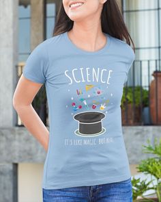 a woman wearing a t - shirt that says science it's just magic time