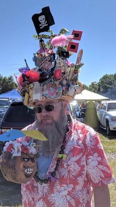 a man wearing a hat made out of objects