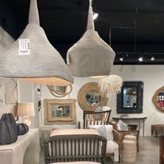 an assortment of furniture and mirrors on display