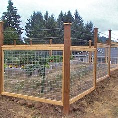 the fence is made of wood and wire