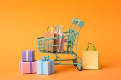 a shopping cart filled with gift boxes and bags