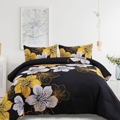 a black and yellow bed with flowers on it