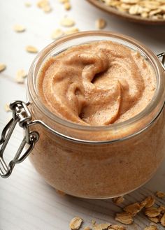 a jar filled with oatmeal sitting on top of a table