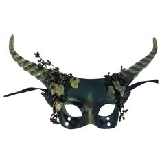 Transform into a legendary woodland creature with the Woodland Mystical Creature Mask! Its fun horns and earthy design make it perfect for Mardi Gras, fantasy parties, or just impressing your pet cat. It’s time to leave the boring behind and embrace your magical side—this mask is here to help you do just that. Fantasy Masks For Halloween, Fantasy Halloween Masks, Horned Masquerade Mask For Halloween Cosplay, Horned Fantasy Masquerade Mask For Halloween, Green Halloween Cosplay Mask, Green Halloween Costume Party Mask, Green Masks And Prosthetics For Halloween Costume Party, Fantasy Horned Costume Accessories For Masquerade, Fantasy Horned Masquerade Mask For Costume