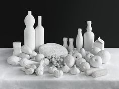 a table topped with lots of white objects