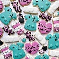 many decorated cookies are displayed on a table